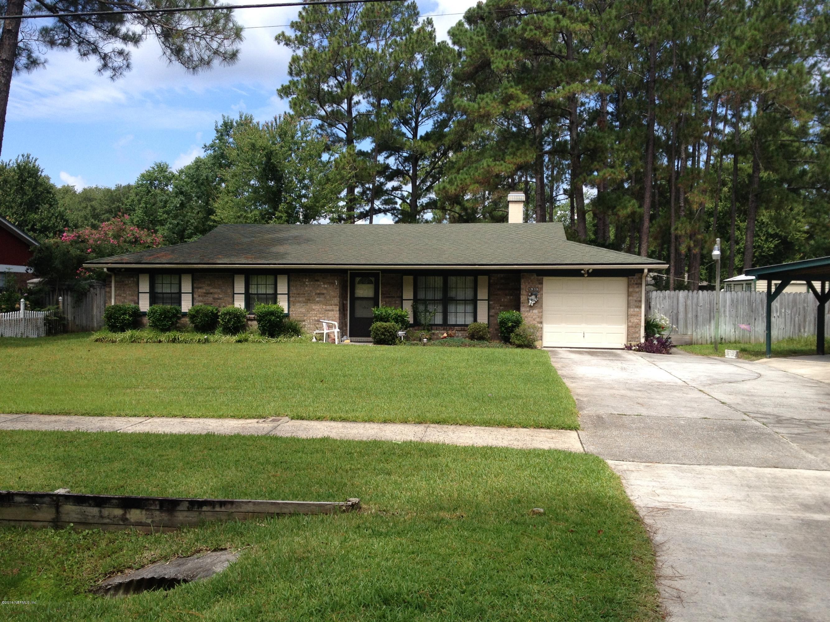 1936 Blair Road Jacksonville, FL 32221 - Photo 1 of 14 a front view of a house with a yard