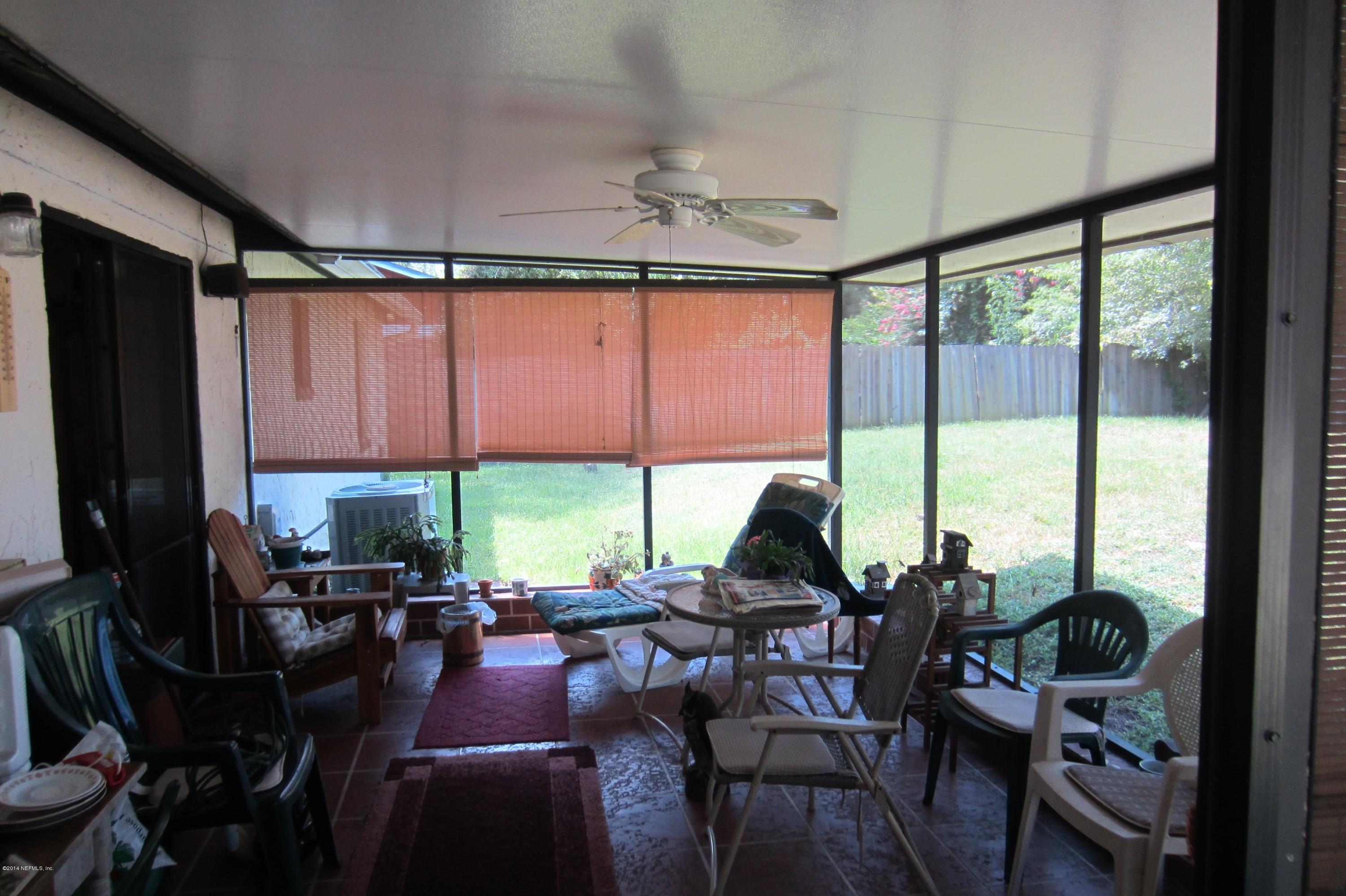 1936 Blair Road Jacksonville, FL 32221 - Photo 13 of 14 a view of a dining room with furniture window and outside view