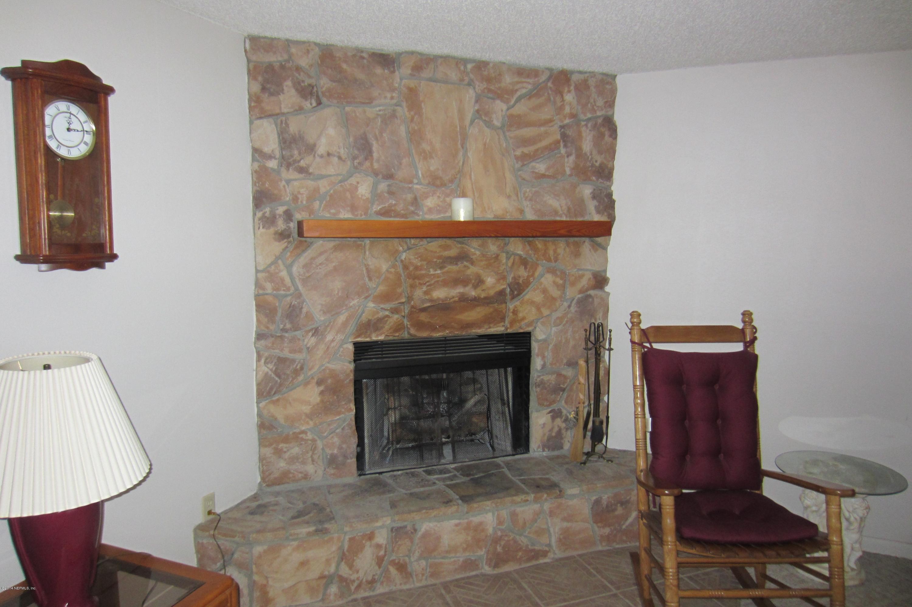 1936 Blair Road Jacksonville, FL 32221 - Photo 3 of 14 a living room with furniture and a fireplace