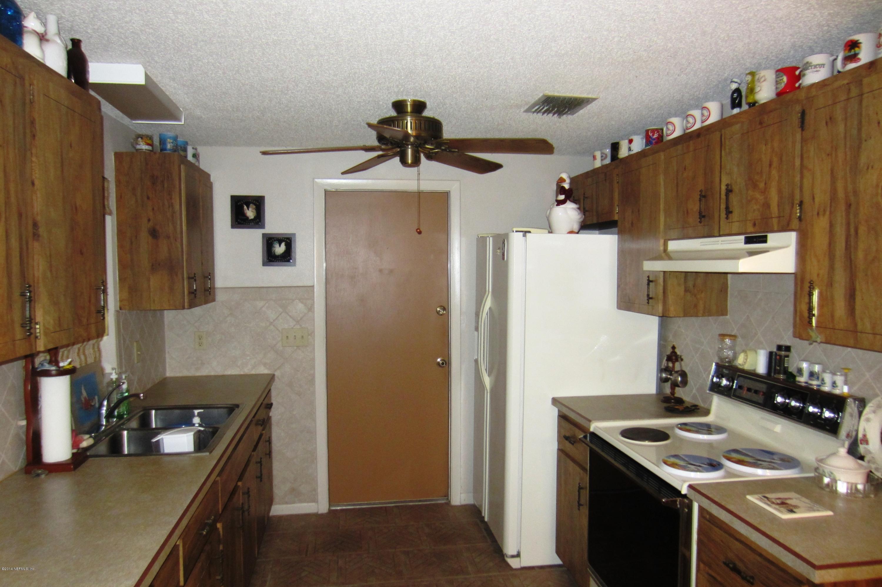 1936 Blair Road Jacksonville, FL 32221 - Photo 4 of 14 a kitchen with refrigerator and sink