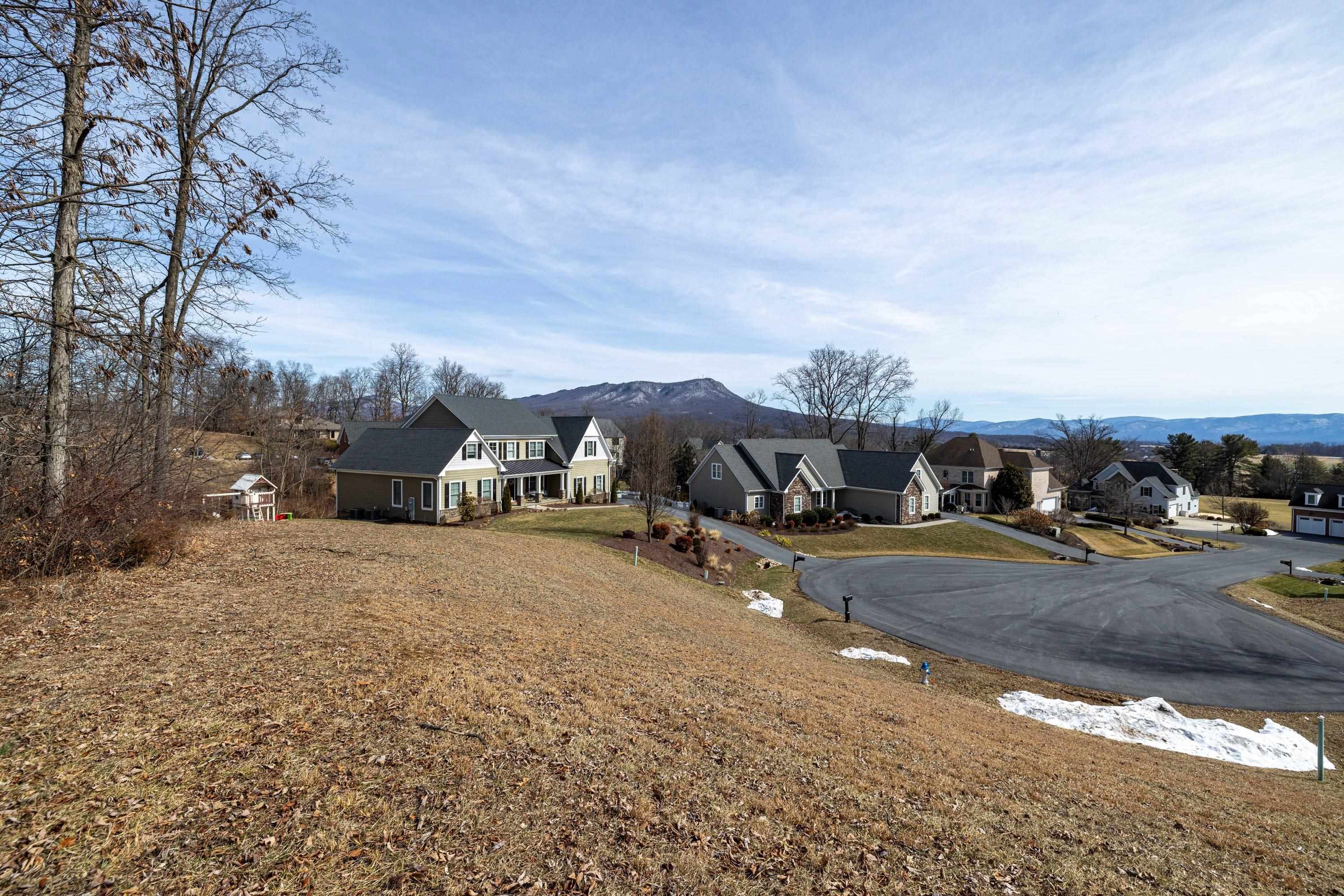 140 Markham Place Harrisonburg, VA 22801 - Photo 12 of 42 a front view of a house with a yard and parking