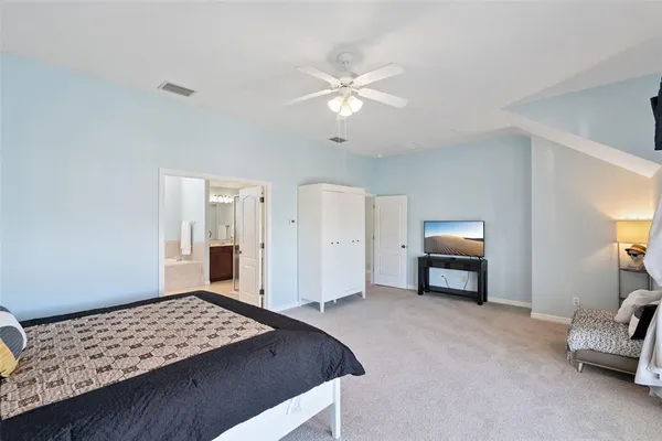 a bedroom with bed and window