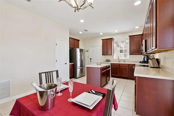 a kitchen with a refrigerator a sink and a stove