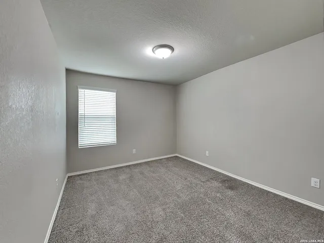 an empty room with a empty space and window