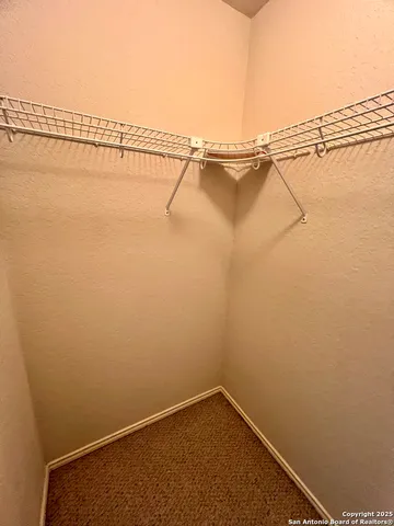 a view of a room with racks on the wall