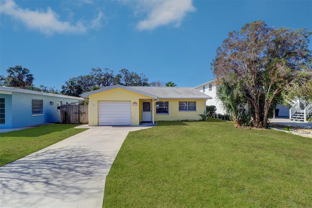123 11th Avenue Indian Rocks Beach, FL 33785 - Photo 1 of 1 a front view of a house with garden