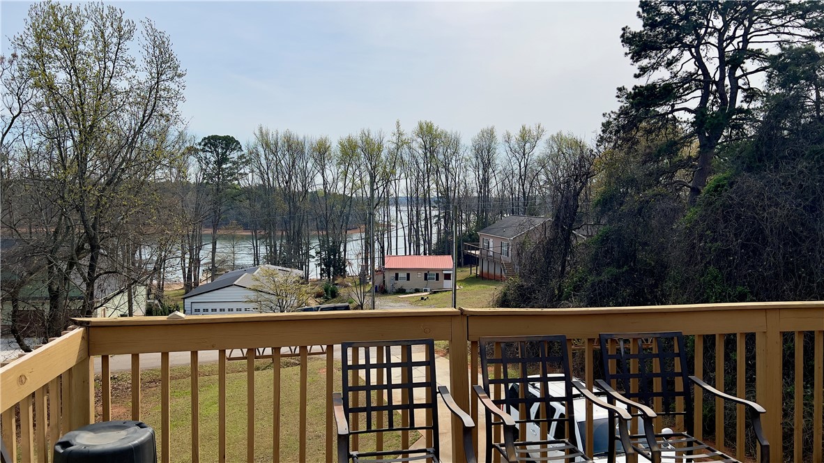 160 Hudgins Lake Road Townville, SC 29689 - Photo 3 of 41 Enjoy tranquil water views from a spacious private deck, perfect for relaxation.