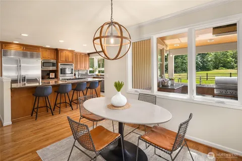 a view of a dining room with furniture window and wooden floor