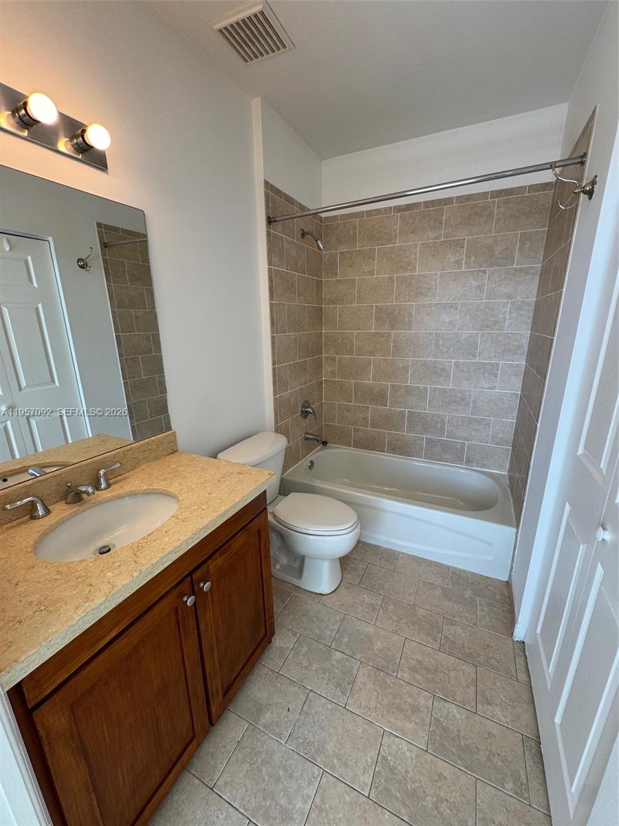 1723 Southwest 2nd Avenue, Unit P08 Miami, FL 33129 - Photo 11 of 21 a bathroom with a granite countertop sink toilet and shower