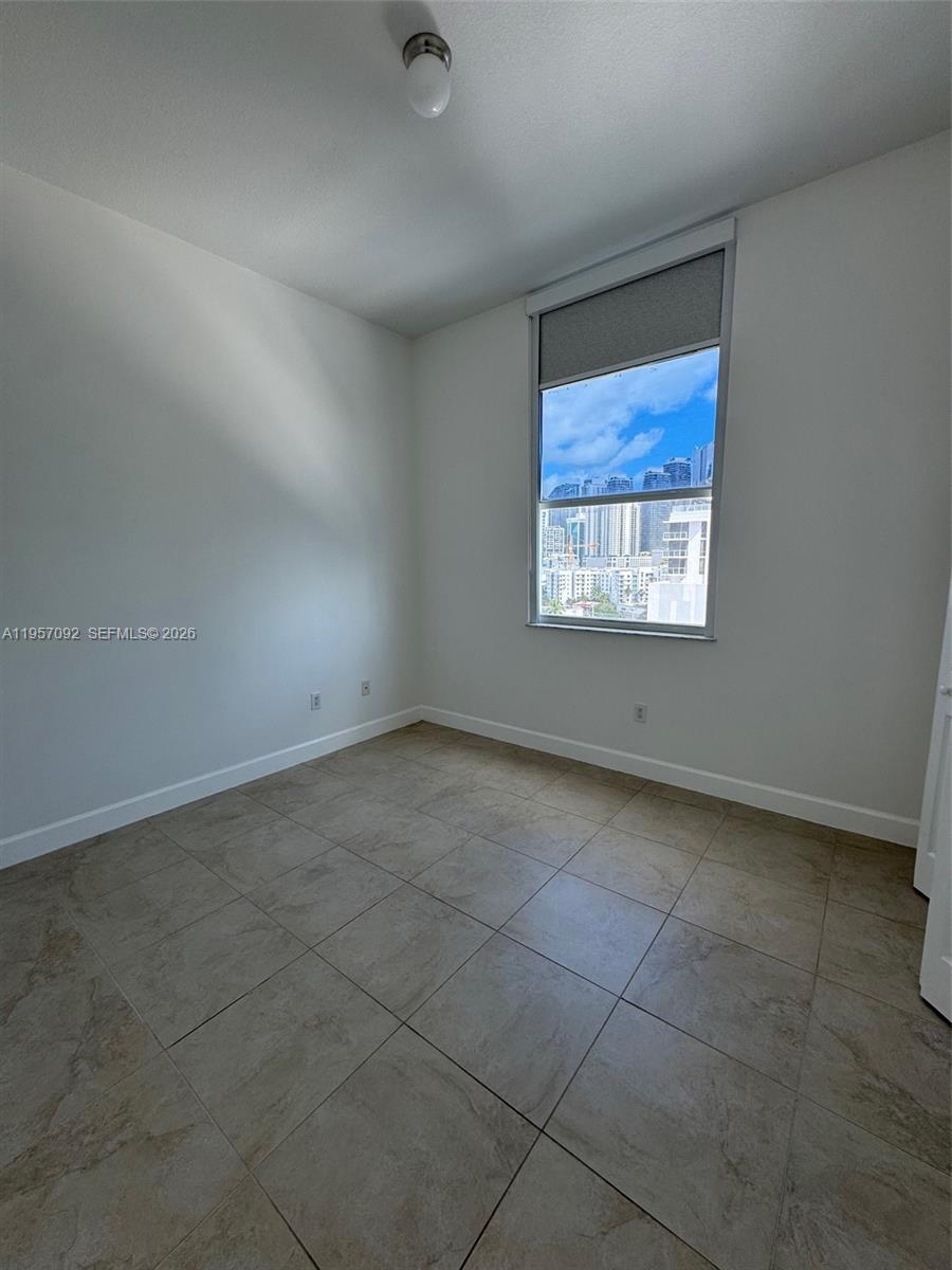 1723 Southwest 2nd Avenue, Unit P08 Miami, FL 33129 - Photo 13 of 21 an empty room with a window