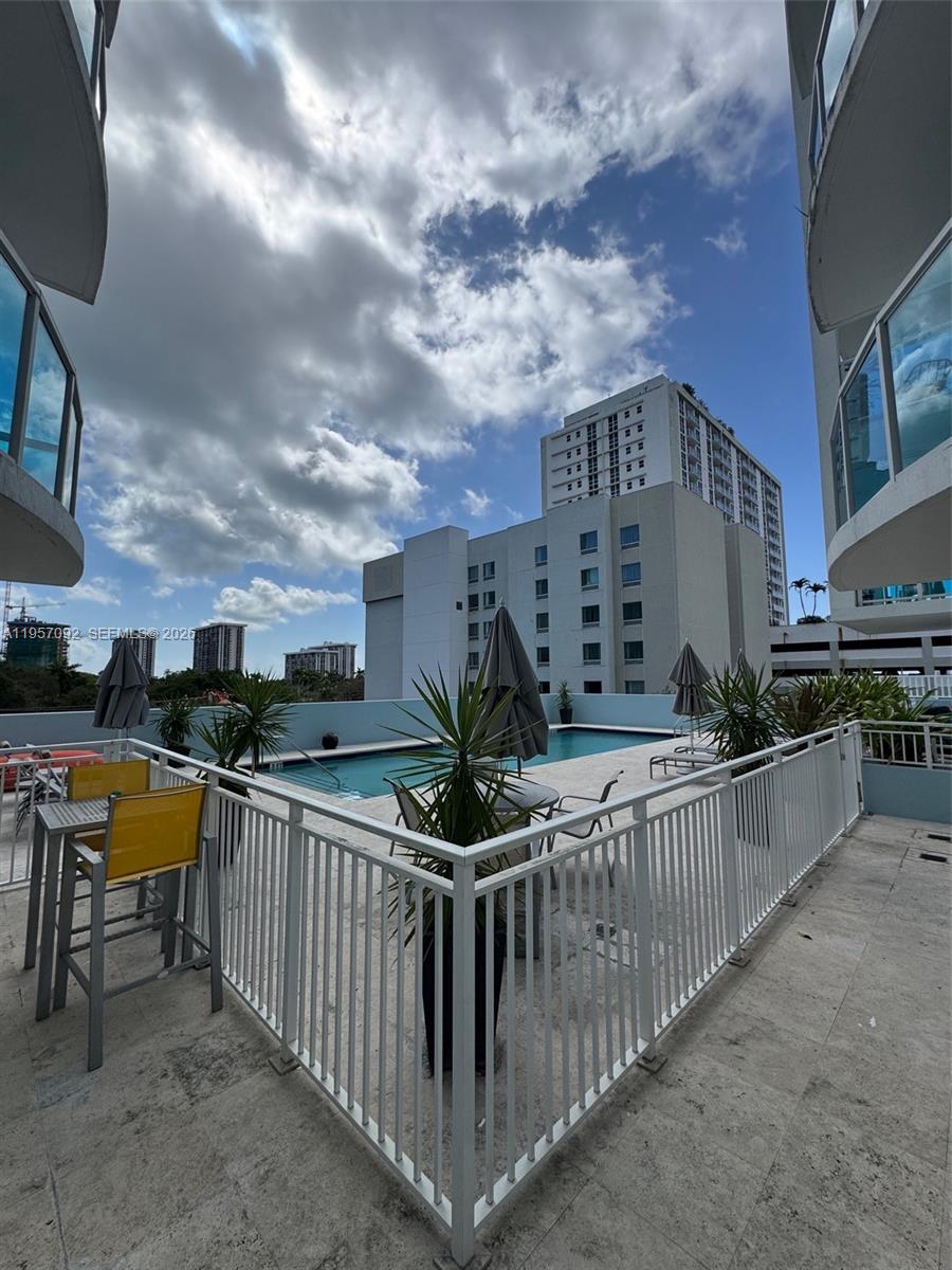 1723 Southwest 2nd Avenue, Unit P08 Miami, FL 33129 - Photo 19 of 21 a view of a balcony with sitting area