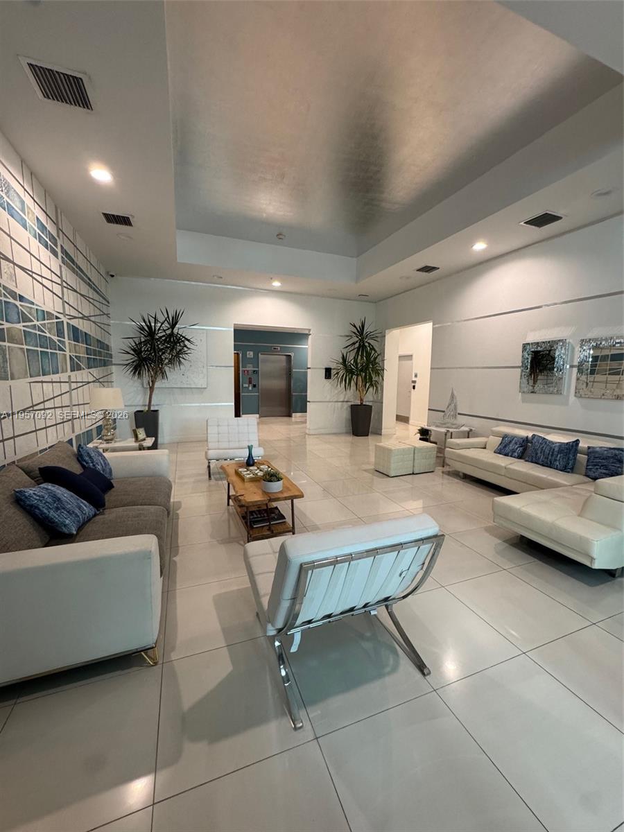 1723 Southwest 2nd Avenue, Unit P08 Miami, FL 33129 - Photo 4 of 21 a living room with furniture and a flat screen tv