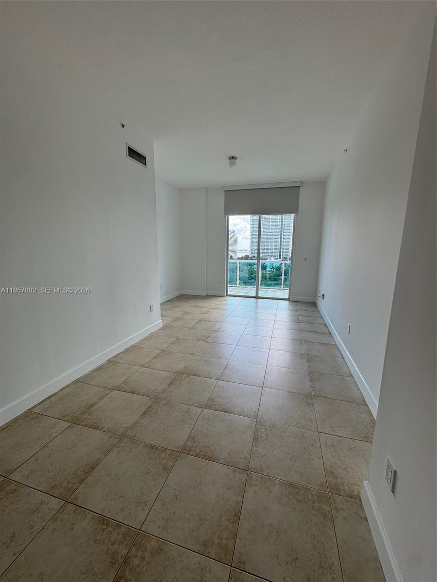 1723 Southwest 2nd Avenue, Unit P08 Miami, FL 33129 - Photo 8 of 21 a view of an empty room with a window