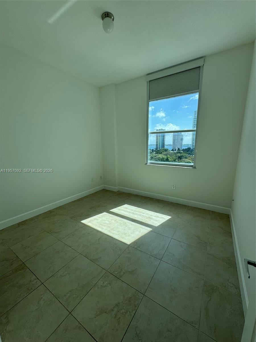 1723 Southwest 2nd Avenue, Unit P08 Miami, FL 33129 - Photo 10 of 21 an empty room with a empty space and window