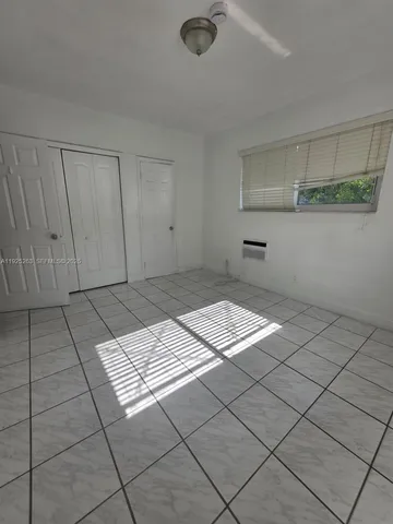 a kitchen with a stove cabinets and a sink