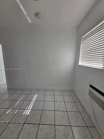 a kitchen with a sink a stove and cabinets