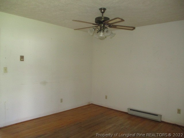 154 Sandy Ridge Church Road Rockingham, NC 28379 - Photo 8 of 19 an empty room with a potted plant on the wall and a shower