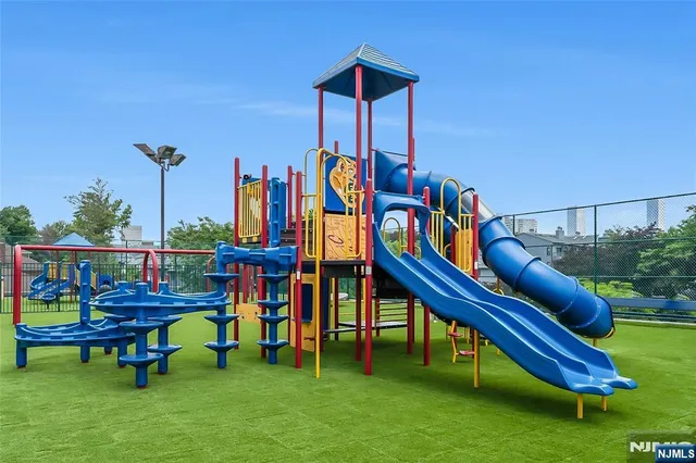 a sign that is sitting in front of a bunch of plants