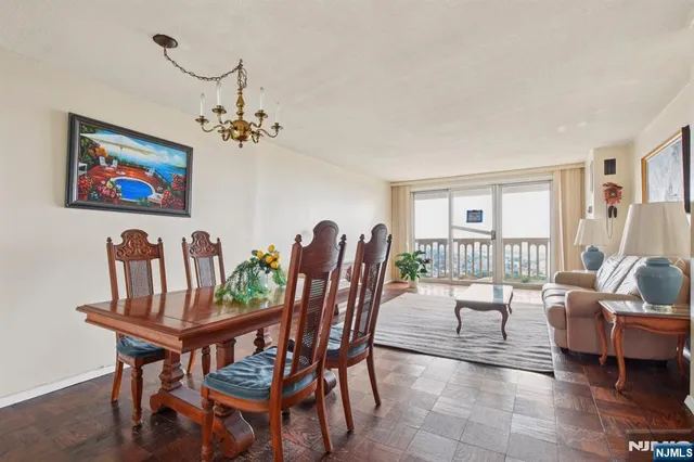 a dining room with furniture and window