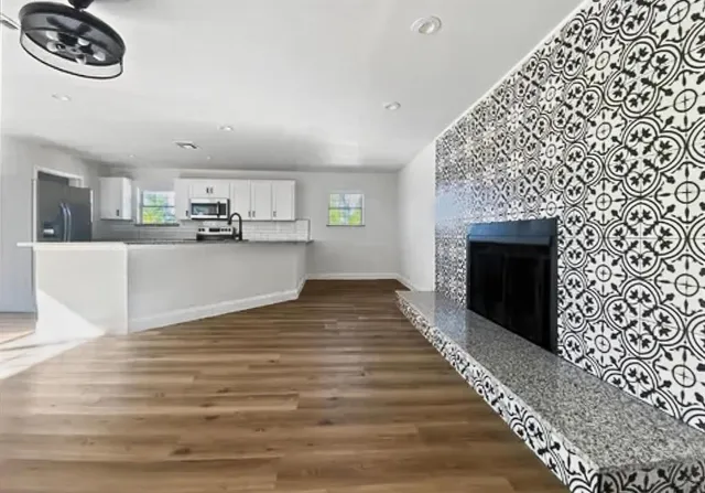 a view of a kitchen with microwave and cabinets