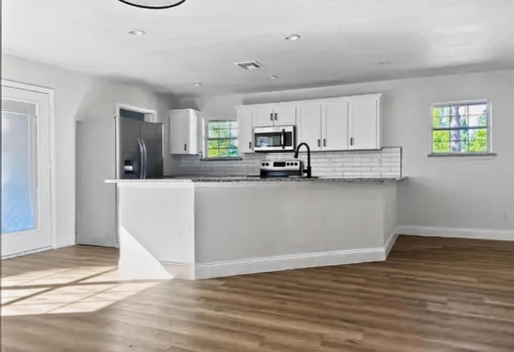 529 Celtic Road Howe, TX 75459 - Photo 3 of 16 a kitchen with sink cabinets and window