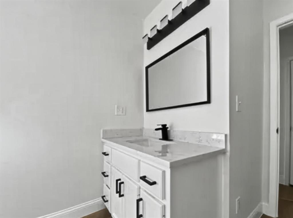 529 Celtic Road Howe, TX 75459 - Photo 7 of 16 a bathroom with a sink and a mirror