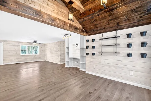 a bathroom with a sink a vanity and a bathtub