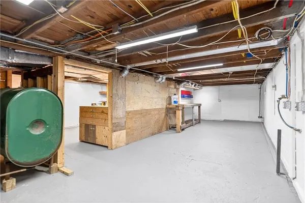 a view of a room with wooden floor and windows