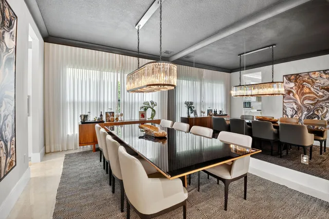 a large white bathroom with a large tub sink and mirror