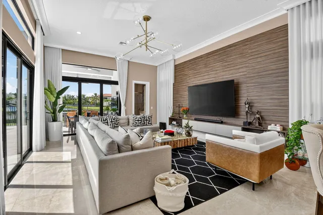 a bedroom with a bed and glass windows