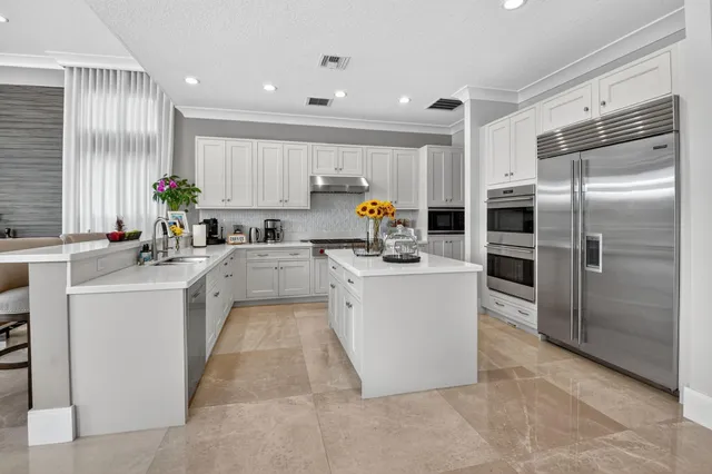 a bathroom with a granite countertop sink a toilet and mirror