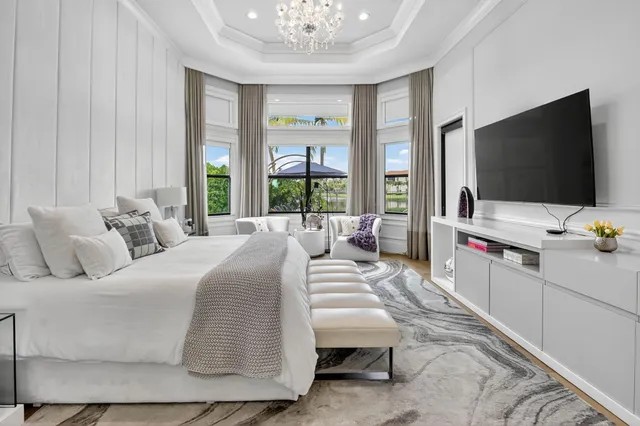 a view of a house with swimming pool and sitting area