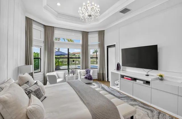 a view of a lake with houses in the back