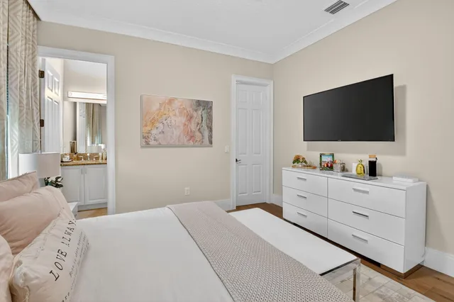 an aerial view of residential houses with outdoor space and parking