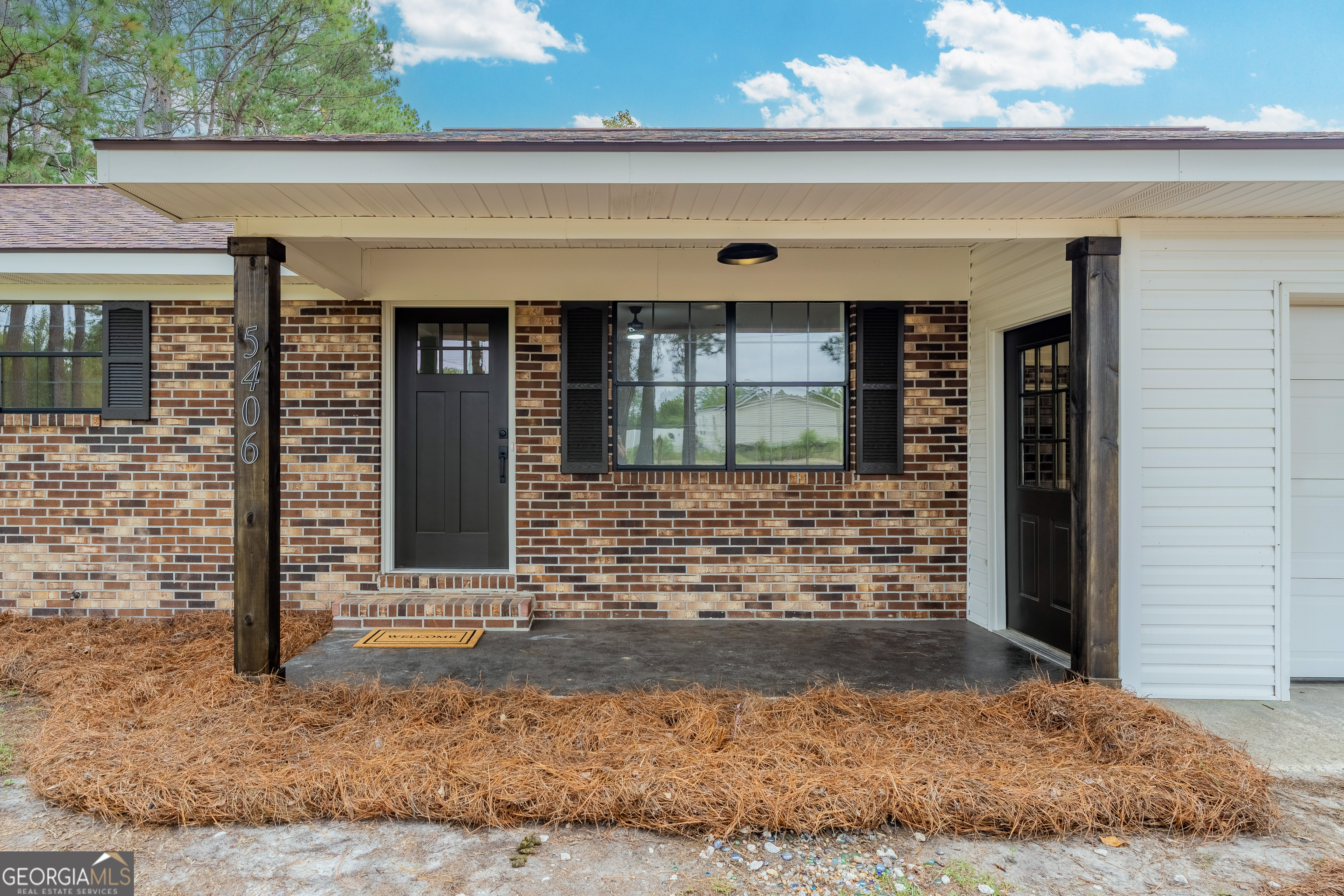 front view of a brick house with a window