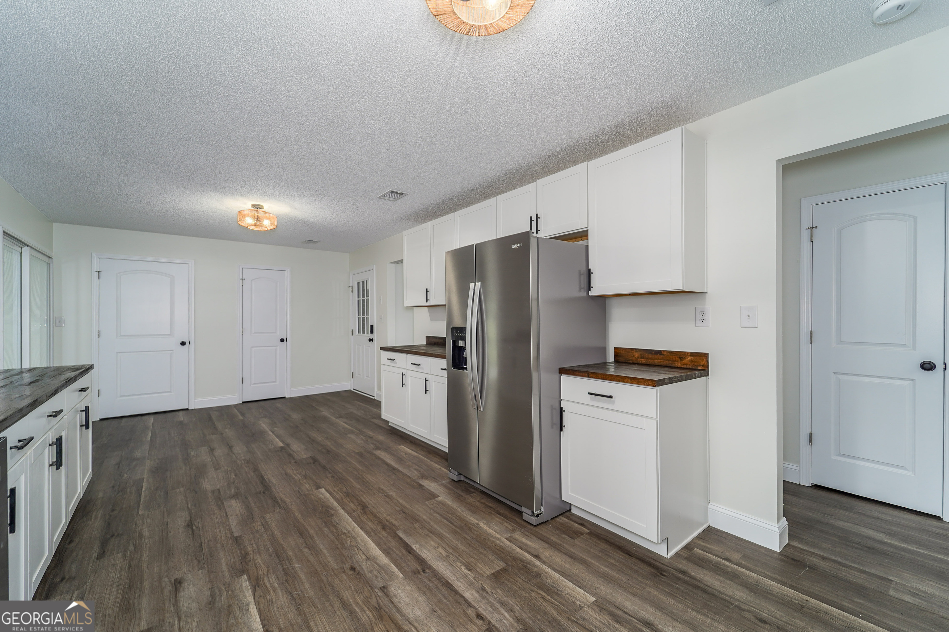 5406 Blue Spruce Road Blackshear, GA 31516 - Photo 11 of 28 a kitchen with stainless steel appliances a refrigerator and a stove top oven