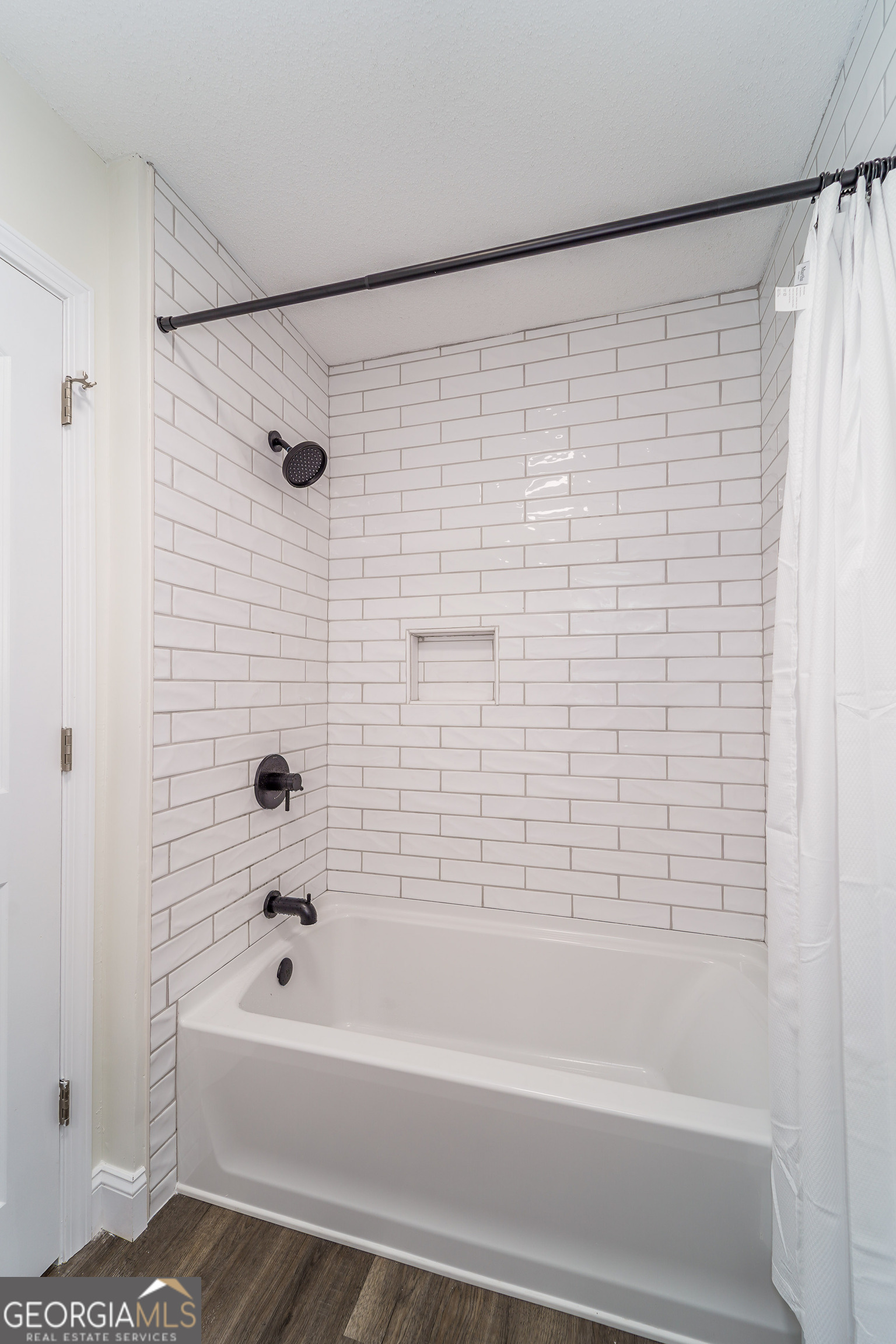 5406 Blue Spruce Road Blackshear, GA 31516 - Photo 24 of 28 a bathroom with a bathtub and a shower
