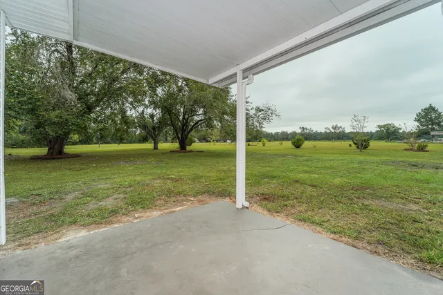 a view of a field with a big yard