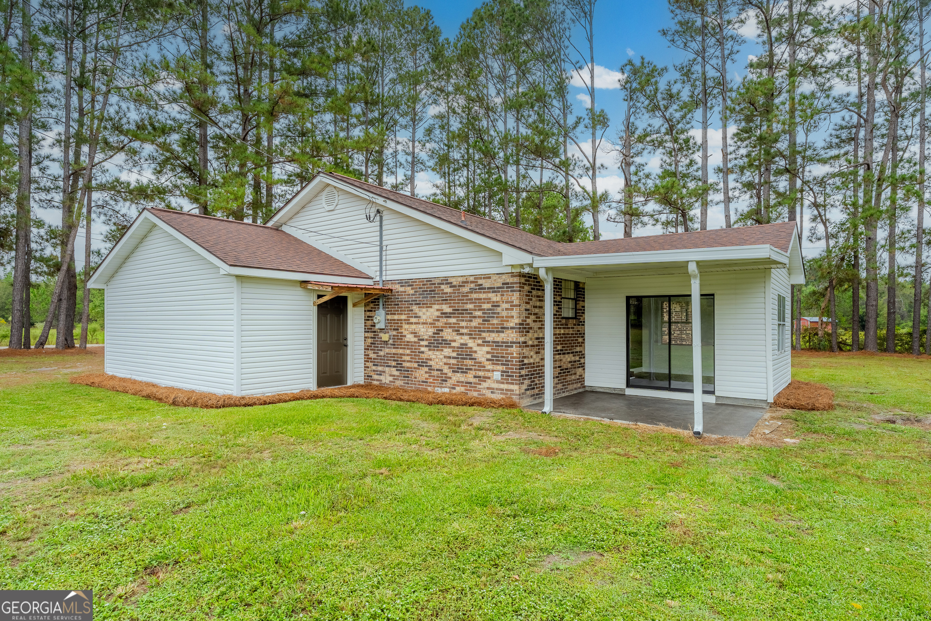 5406 Blue Spruce Road Blackshear, GA 31516 - Photo 5 of 28 a view of a house with a yard