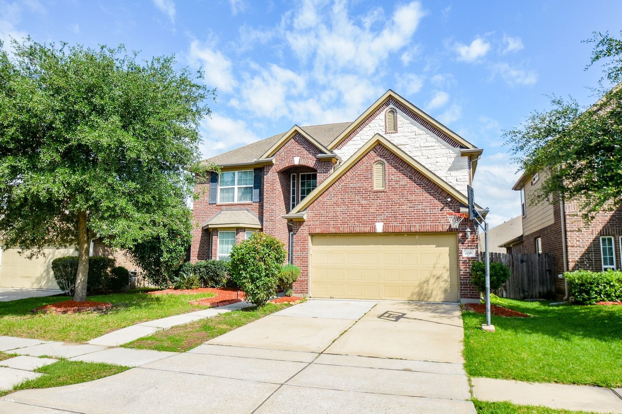 7046 Sliding Rock Circle Spring, TX 77379 - Photo 1 of 41 Charming two-story brick home with inviting curb appeal and a spacious two-car garage.