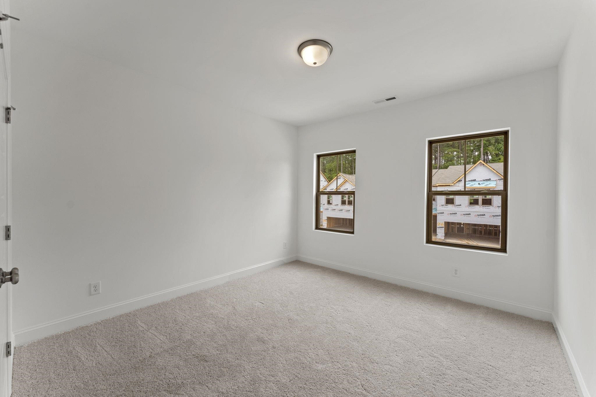 2128 Voekler Street Apex, NC 27502 - Photo 11 of 27 an empty room with windows