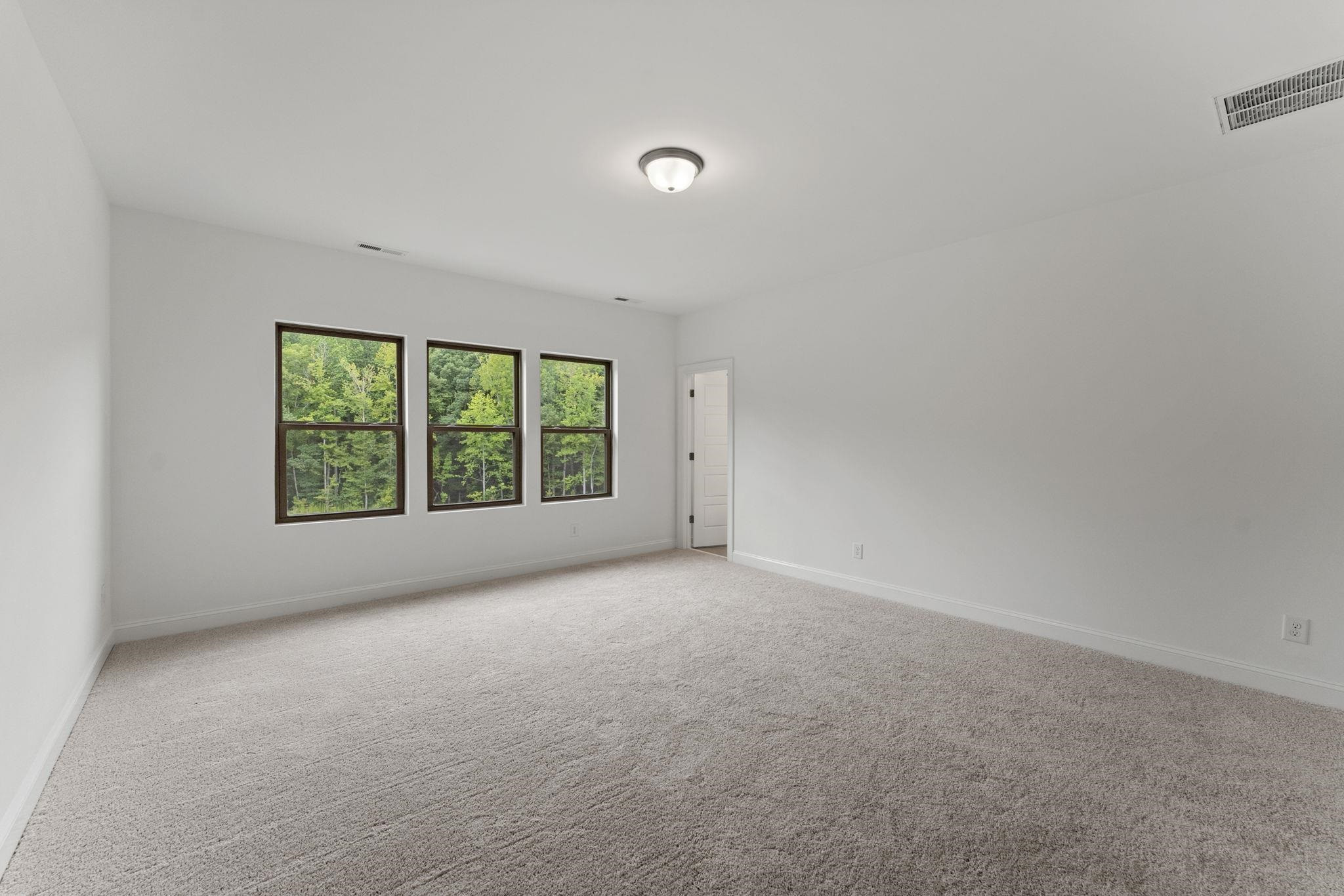 2128 Voekler Street Apex, NC 27502 - Photo 13 of 27 an empty room with windows