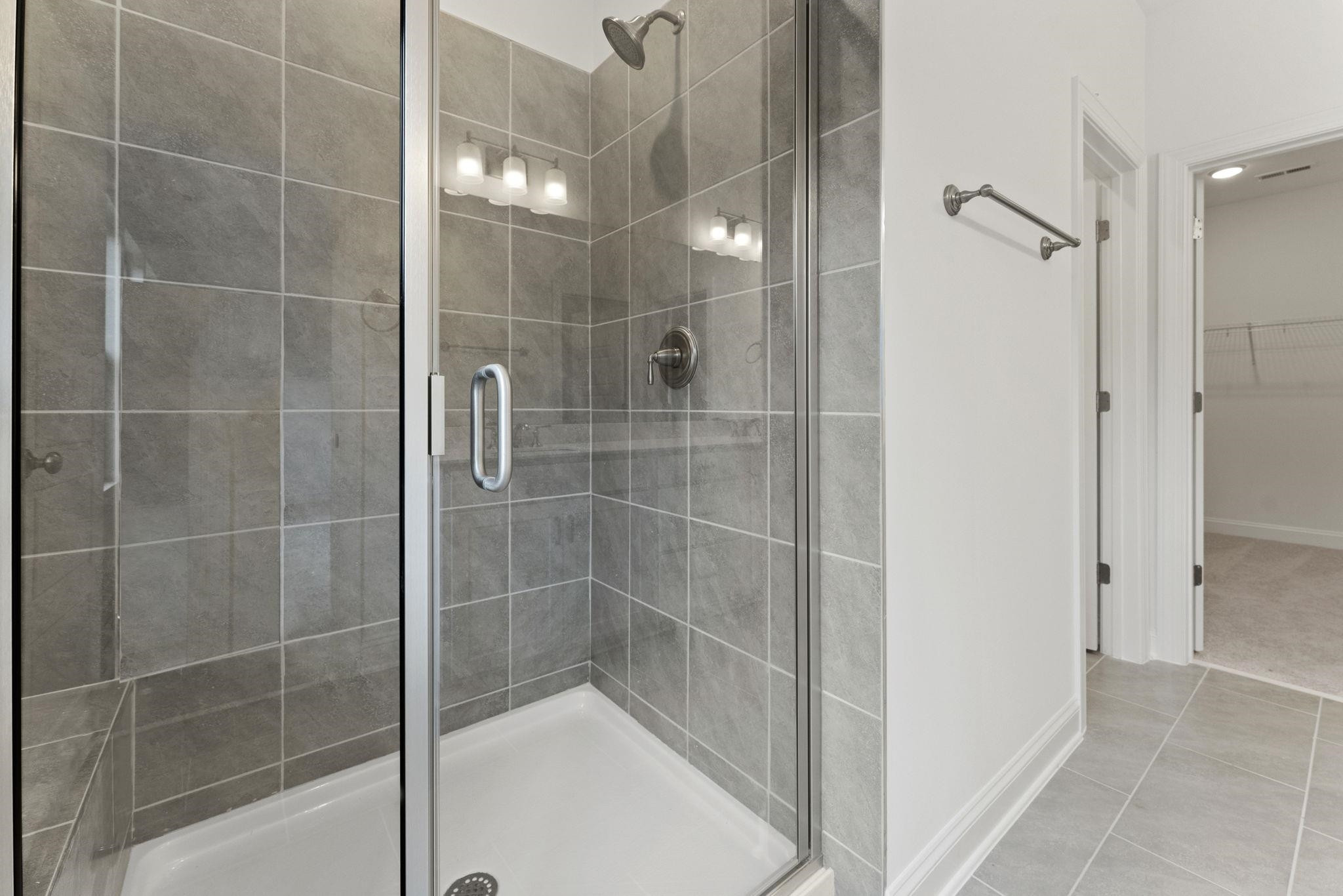 2128 Voekler Street Apex, NC 27502 - Photo 17 of 27 a bathroom with a shower