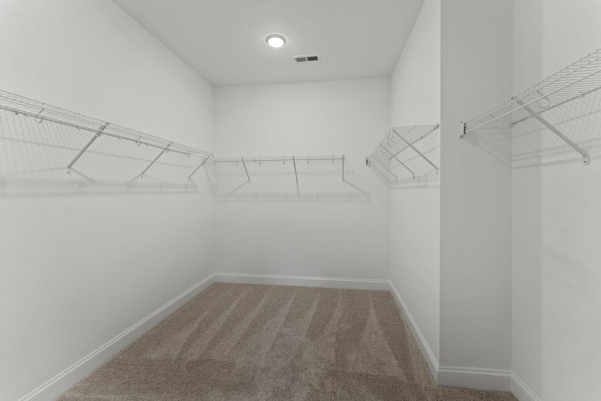2128 Voekler Street Apex, NC 27502 - Photo 18 of 27 a view of a room with racks on the wall