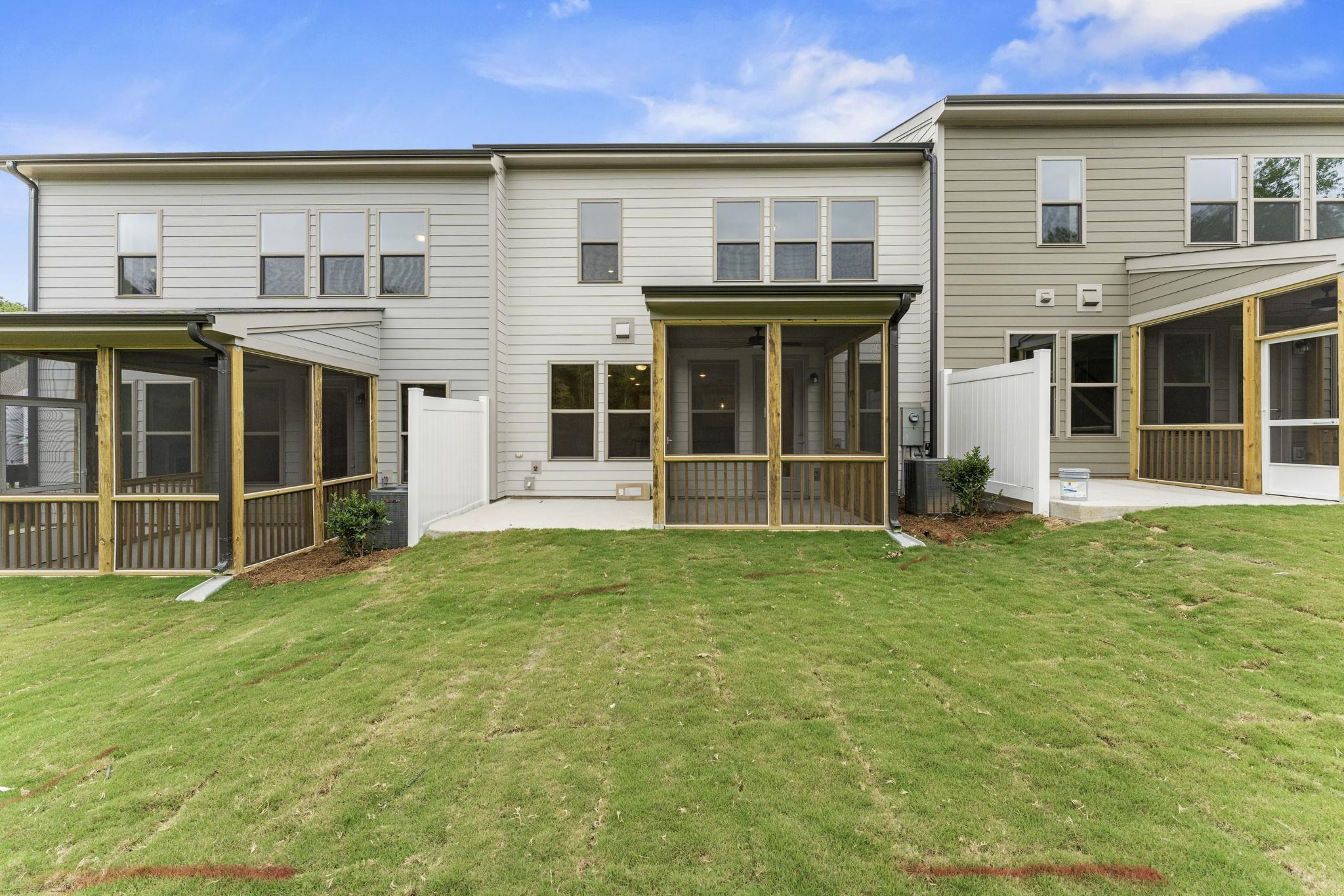2128 Voekler Street Apex, NC 27502 - Photo 22 of 27 front view of a brick house with a yard