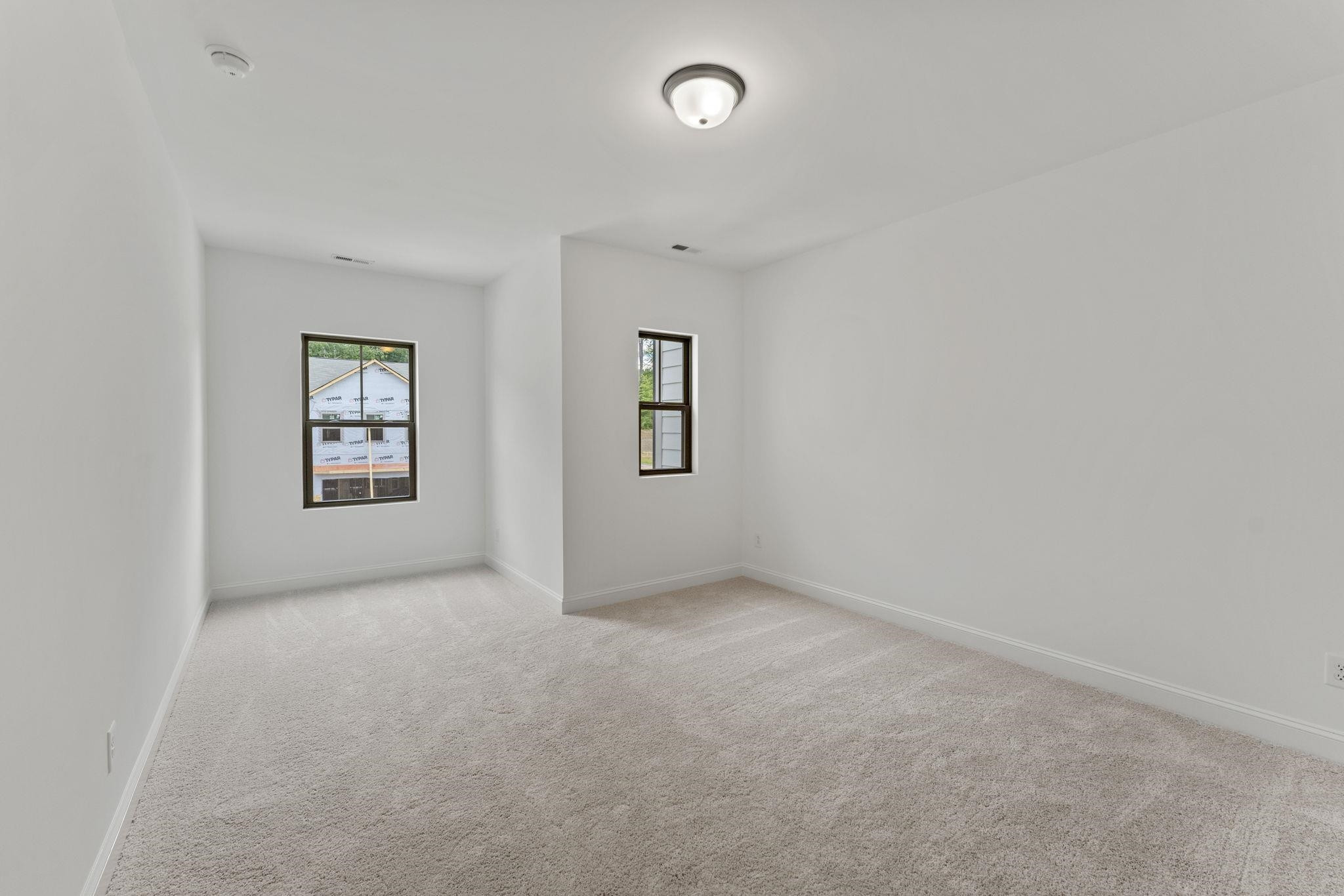 2128 Voekler Street Apex, NC 27502 - Photo 10 of 27 an empty room with windows and windows