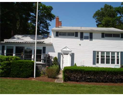 92 Acres Of Pine Road Coventry, RI 02816 - Photo 3 of 12 Exterior Back. Sliders open to a deck with electric awning and patio to enjoy the views.