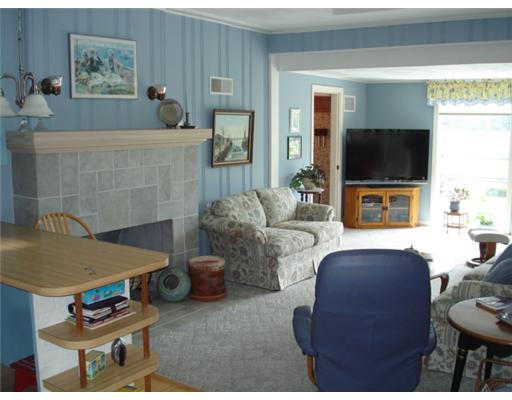 92 Acres Of Pine Road Coventry, RI 02816 - Photo 5 of 12 Living Room. living room with fireplace and great views of the pond.