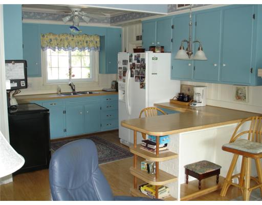 92 Acres Of Pine Road Coventry, RI 02816 - Photo 6 of 12 Kitchen. Kitchen with hardwoods and breakfast bar.