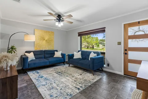 a living room with furniture and a window